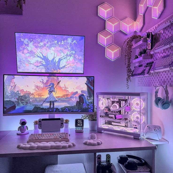 The bloondbetau test room with two gaming monitors side by side, lit in soft pink